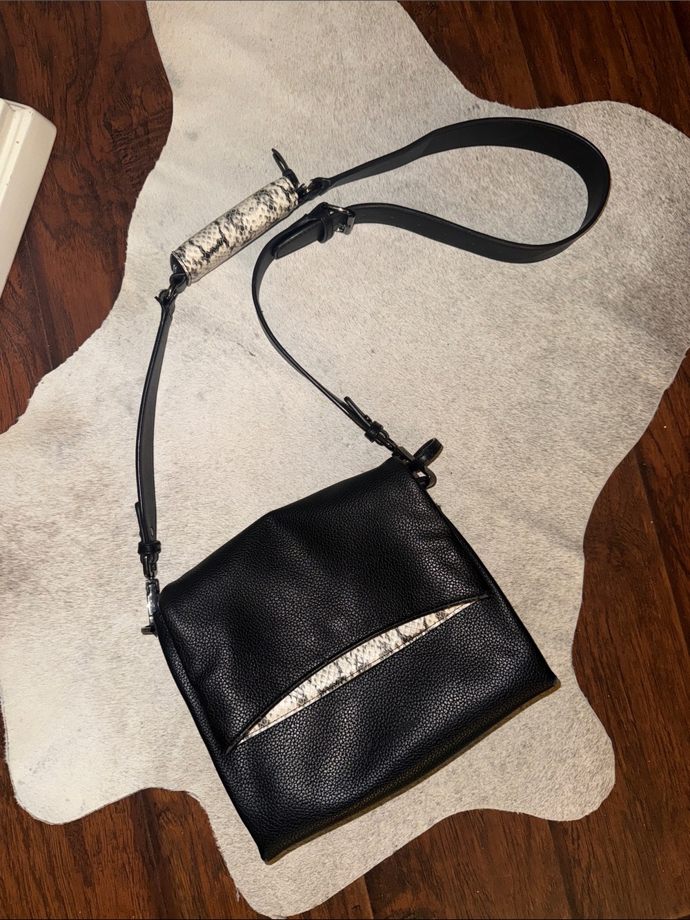 Black Calvin Klein’s Women's Leather Crossbody Bag with Snake-Print Accent
